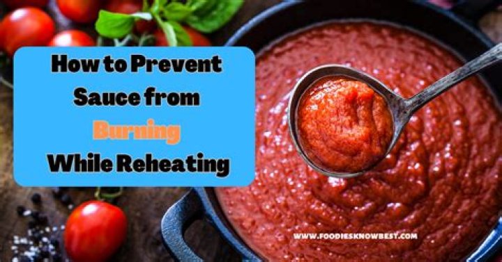 How do you prevent sauce from burning while reheating?