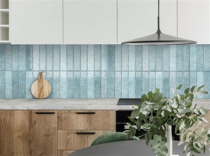 Where should you lay the first tile for a splashback?
