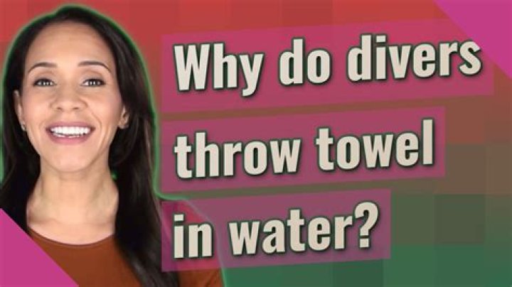 Why do divers hit themselves with towels?